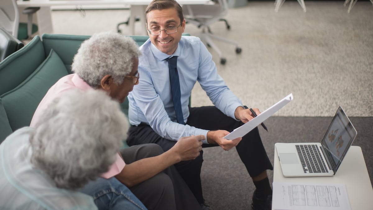 Consultant explaining tax resolution options to senior clients